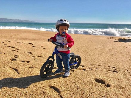 baby on a balance bike