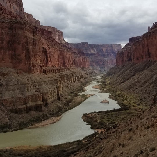 A river flowing through a desert canyon.
